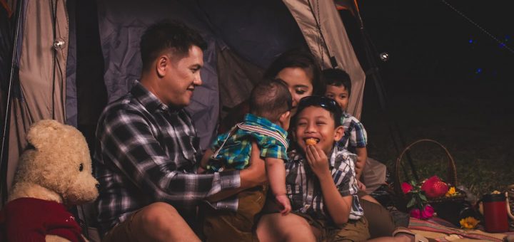a family in their camping tent