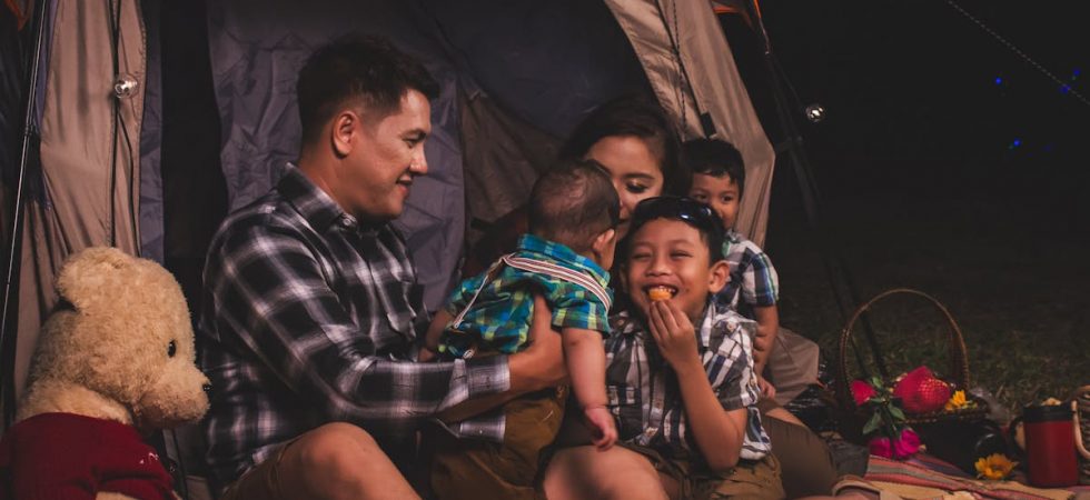 a family in their camping tent
