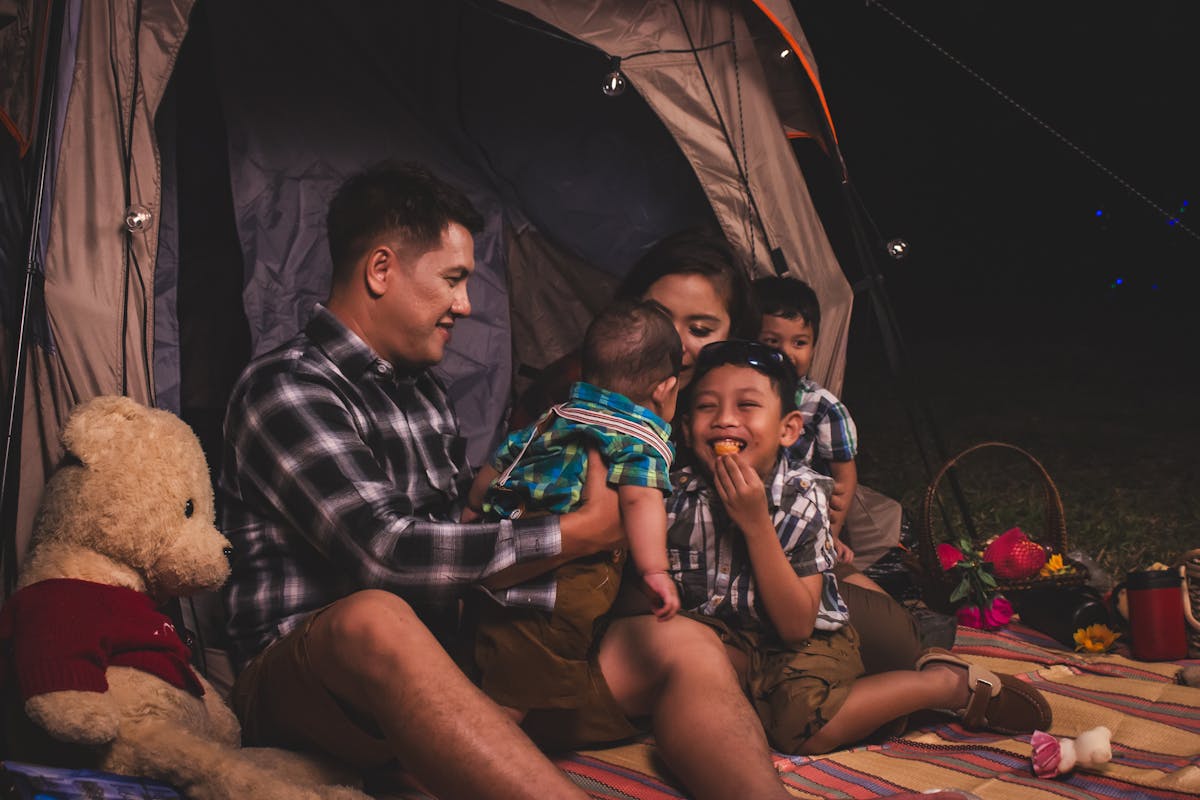 a family in their camping tent